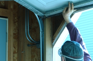 Lift the garage door around the broken pulley.