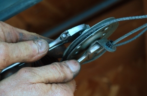 Loosen the nut on the other pulley.