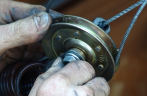 Finger tighten the nut on the new pulley.