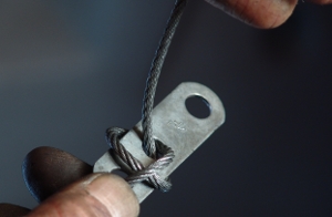 Threading the cable through the cable clip.