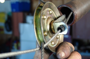 Cable on the new pulley at the extension spring.