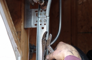 Remove the vise-grip from the track.